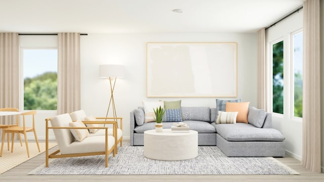 living area with baseboards and wood finished floors