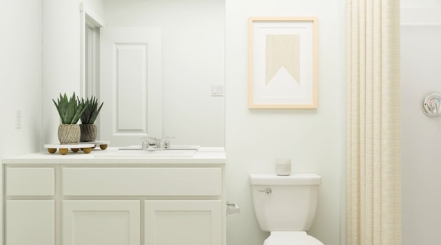 bathroom featuring vanity and toilet