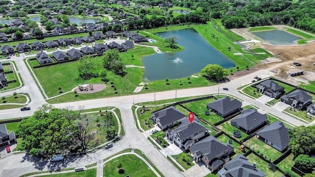 birds eye view of property featuring a water view and a residential view