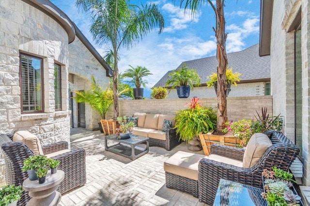 view of patio / terrace featuring outdoor lounge area and a fenced backyard