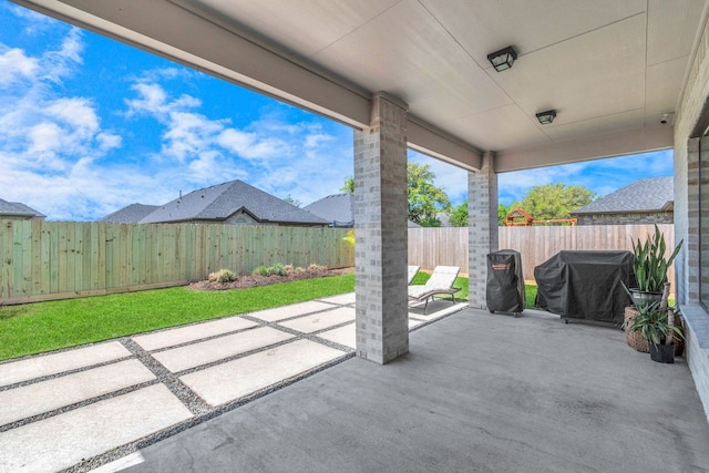 view of patio / terrace with area for grilling and a fenced backyard