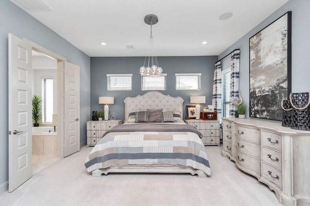 bedroom with recessed lighting, light colored carpet, and an inviting chandelier