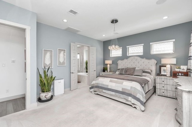 bedroom featuring light carpet, baseboards, visible vents, ensuite bathroom, and recessed lighting