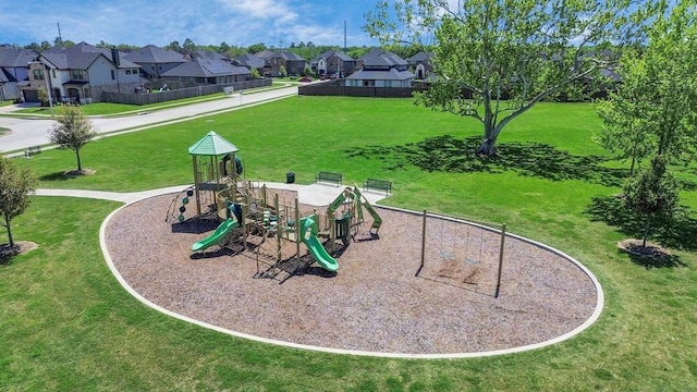 view of community with a residential view, playground community, and a yard