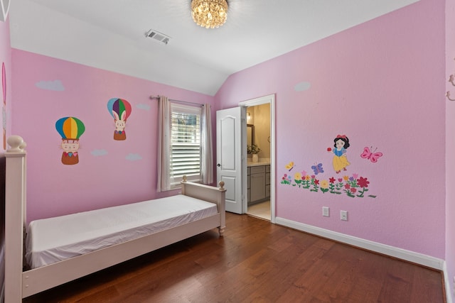 bedroom with visible vents, connected bathroom, dark wood-type flooring, baseboards, and vaulted ceiling