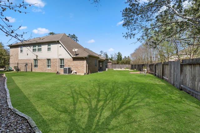 view of yard featuring cooling unit and a fenced backyard