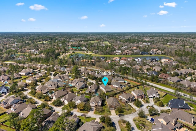 bird's eye view with a residential view and a water view