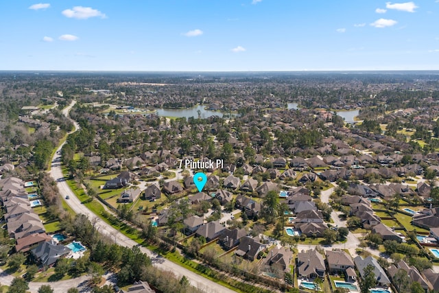 bird's eye view featuring a residential view and a water view