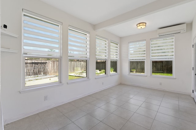 unfurnished sunroom featuring an AC wall unit and beam ceiling