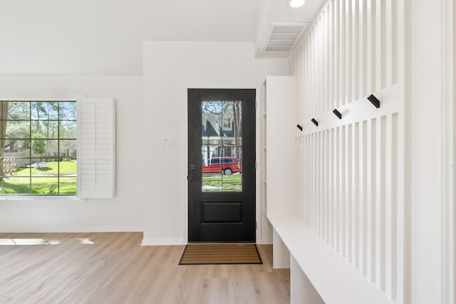 mudroom with visible vents, baseboards, and light wood-style flooring