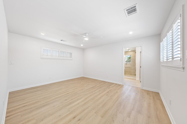 empty room with visible vents, baseboards, ceiling fan, recessed lighting, and light wood-style flooring