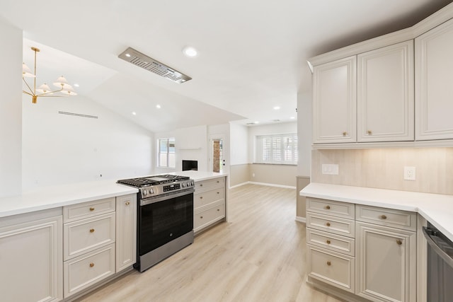 kitchen with light wood finished floors, open floor plan, light countertops, recessed lighting, and appliances with stainless steel finishes