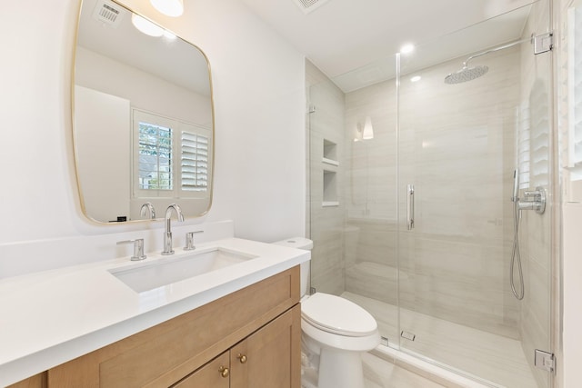 full bathroom with visible vents, vanity, toilet, and a shower stall