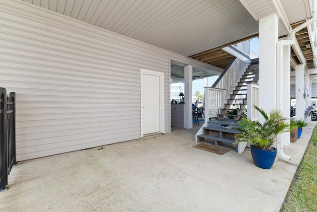 view of patio featuring stairway