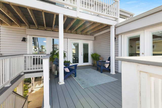 wooden deck featuring french doors