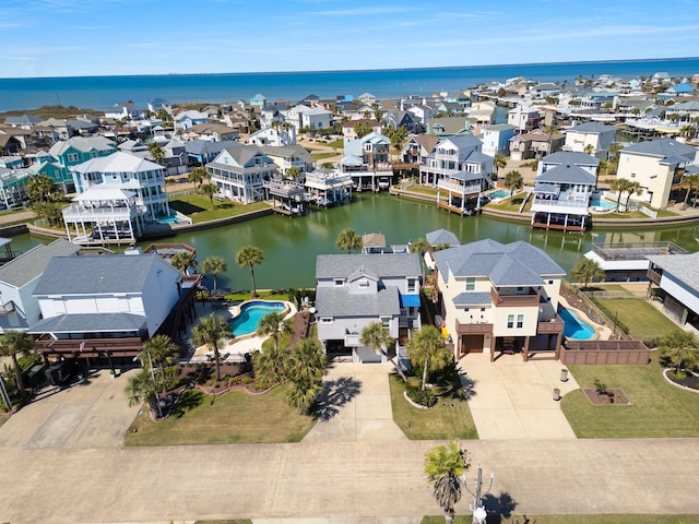 birds eye view of property with a residential view and a water view