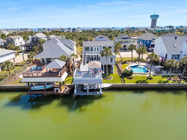 bird's eye view featuring a water view and a residential view