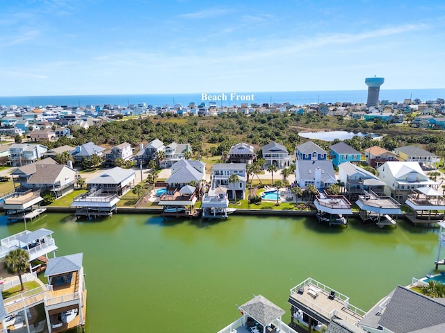 birds eye view of property with a residential view and a water view