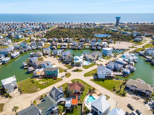 bird's eye view featuring a water view and a residential view