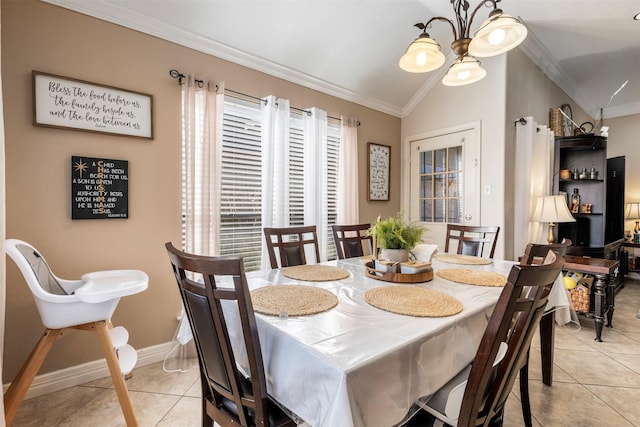 dining space featuring light tile patterned floors, a chandelier, lofted ceiling, baseboards, and crown molding