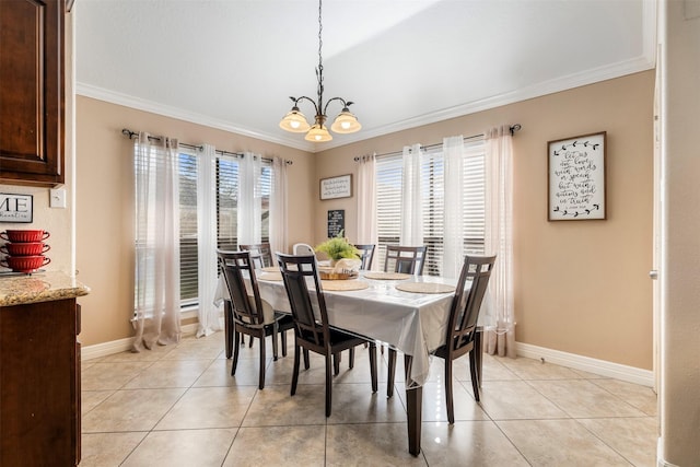 dining area with ornamental molding, a healthy amount of sunlight, baseboards, and light tile patterned floors