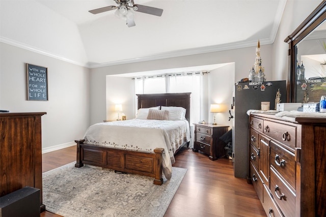 bedroom with baseboards, a ceiling fan, lofted ceiling, dark wood-style floors, and crown molding