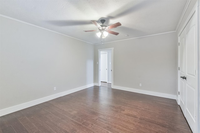 unfurnished room featuring baseboards, dark wood finished floors, ceiling fan, ornamental molding, and a textured ceiling