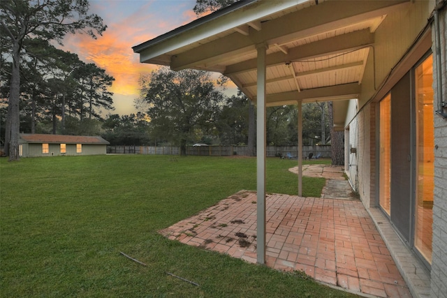 view of yard featuring a patio and fence