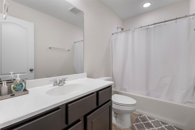 bathroom featuring visible vents, toilet, shower / bath combo with shower curtain, vanity, and tile patterned floors