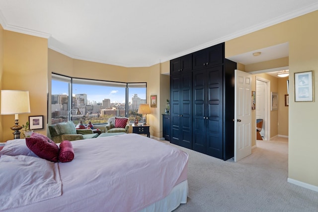 bedroom featuring a city view, crown molding, light colored carpet, and baseboards