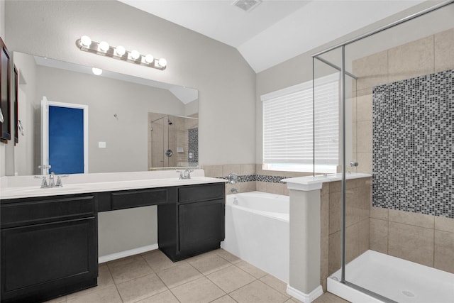 full bath featuring tile patterned floors, a stall shower, a sink, a bath, and vaulted ceiling