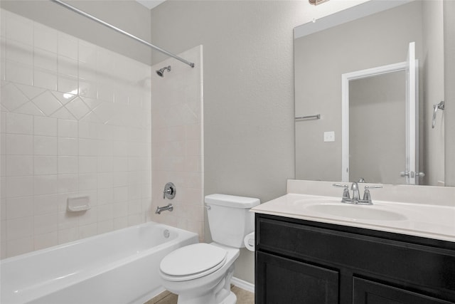 bathroom featuring vanity, toilet, shower / bath combination, and baseboards