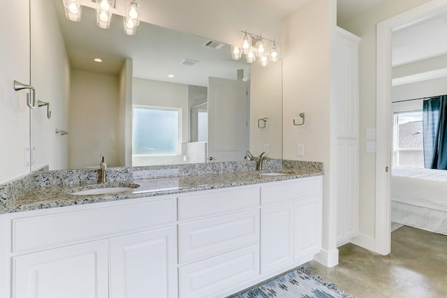 bathroom featuring a wealth of natural light, visible vents, and a sink