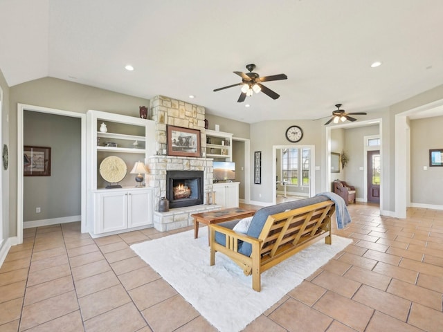 living area with recessed lighting, light tile patterned flooring, and a stone fireplace