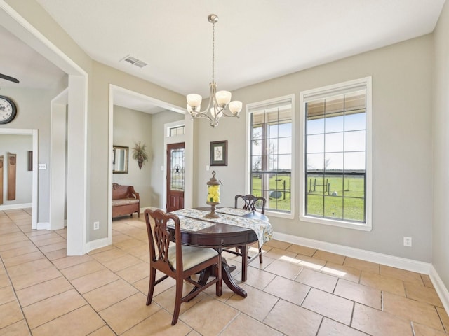 dining room with visible vents, plenty of natural light, baseboards, and light tile patterned flooring