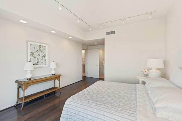 bedroom with recessed lighting, visible vents, and wood finished floors