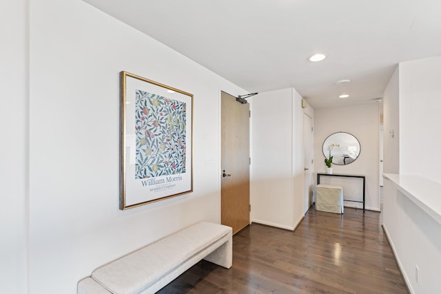 hallway featuring recessed lighting, baseboards, and wood finished floors