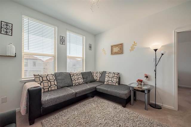 living room featuring carpet flooring and baseboards