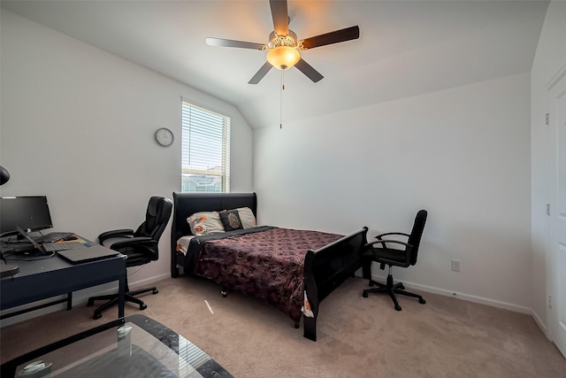 bedroom featuring light carpet, baseboards, lofted ceiling, and a ceiling fan