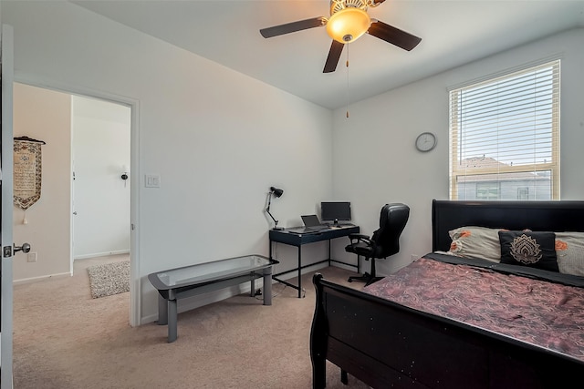 bedroom with ceiling fan, baseboards, and light carpet