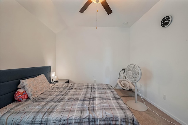 carpeted bedroom featuring vaulted ceiling, a ceiling fan, and baseboards