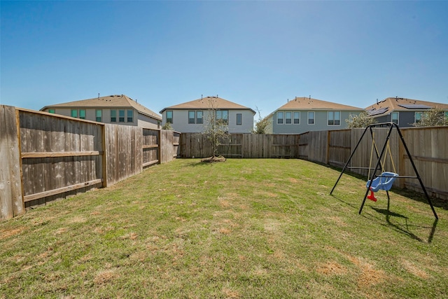 view of yard with a fenced backyard