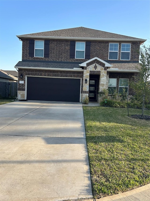 traditional home with a front yard, concrete driveway, and brick siding