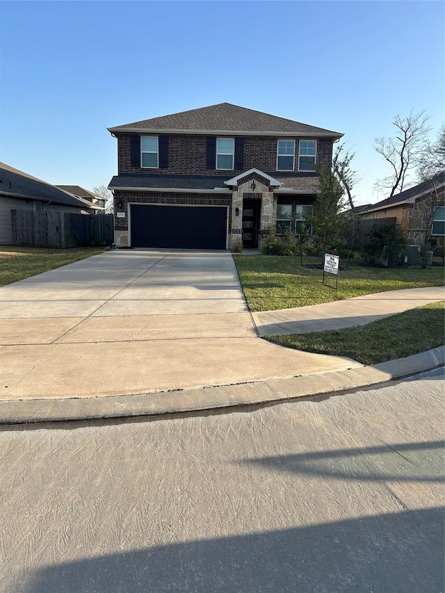 view of front facade with an attached garage, brick siding, fence, concrete driveway, and a front lawn