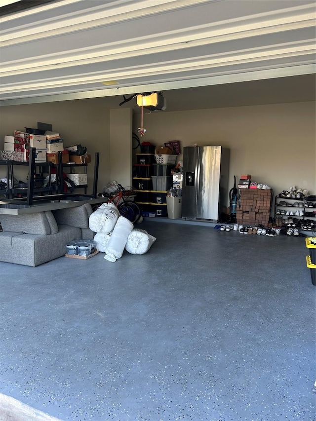 garage featuring stainless steel fridge