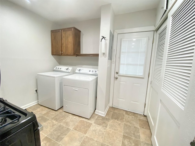 laundry area featuring laundry area, washing machine and clothes dryer, and baseboards