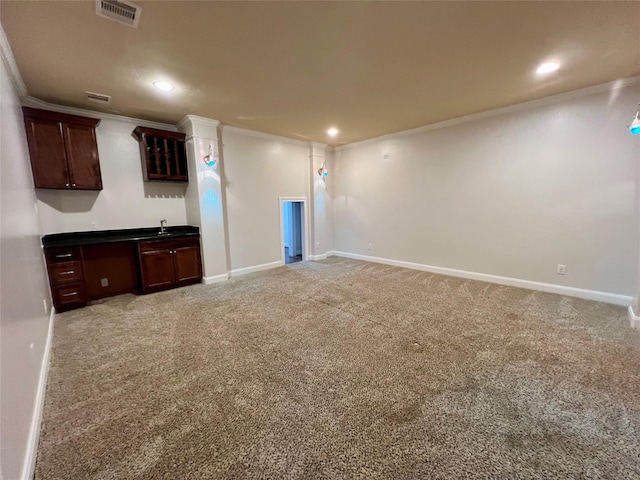 interior space featuring light carpet, visible vents, crown molding, and baseboards