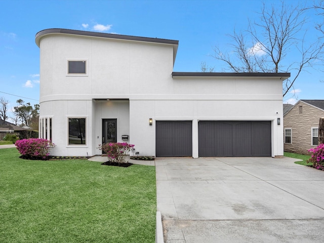 view of front of property featuring stucco siding, an attached garage, concrete driveway, and a front yard