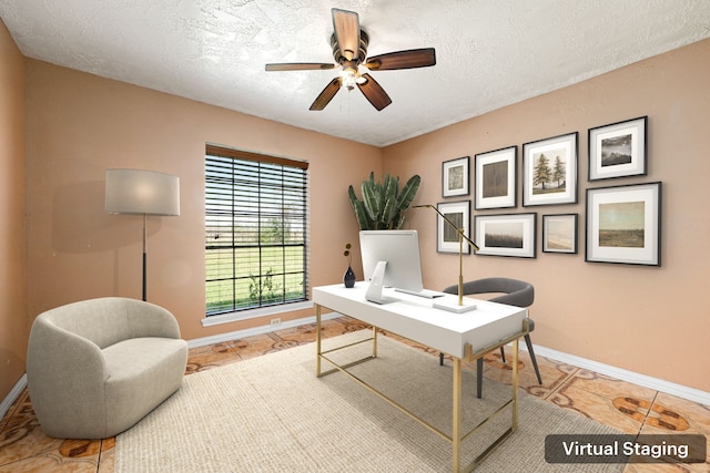 office featuring ceiling fan, tile patterned floors, baseboards, and a textured ceiling