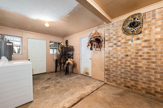 interior space featuring water heater and washer and clothes dryer